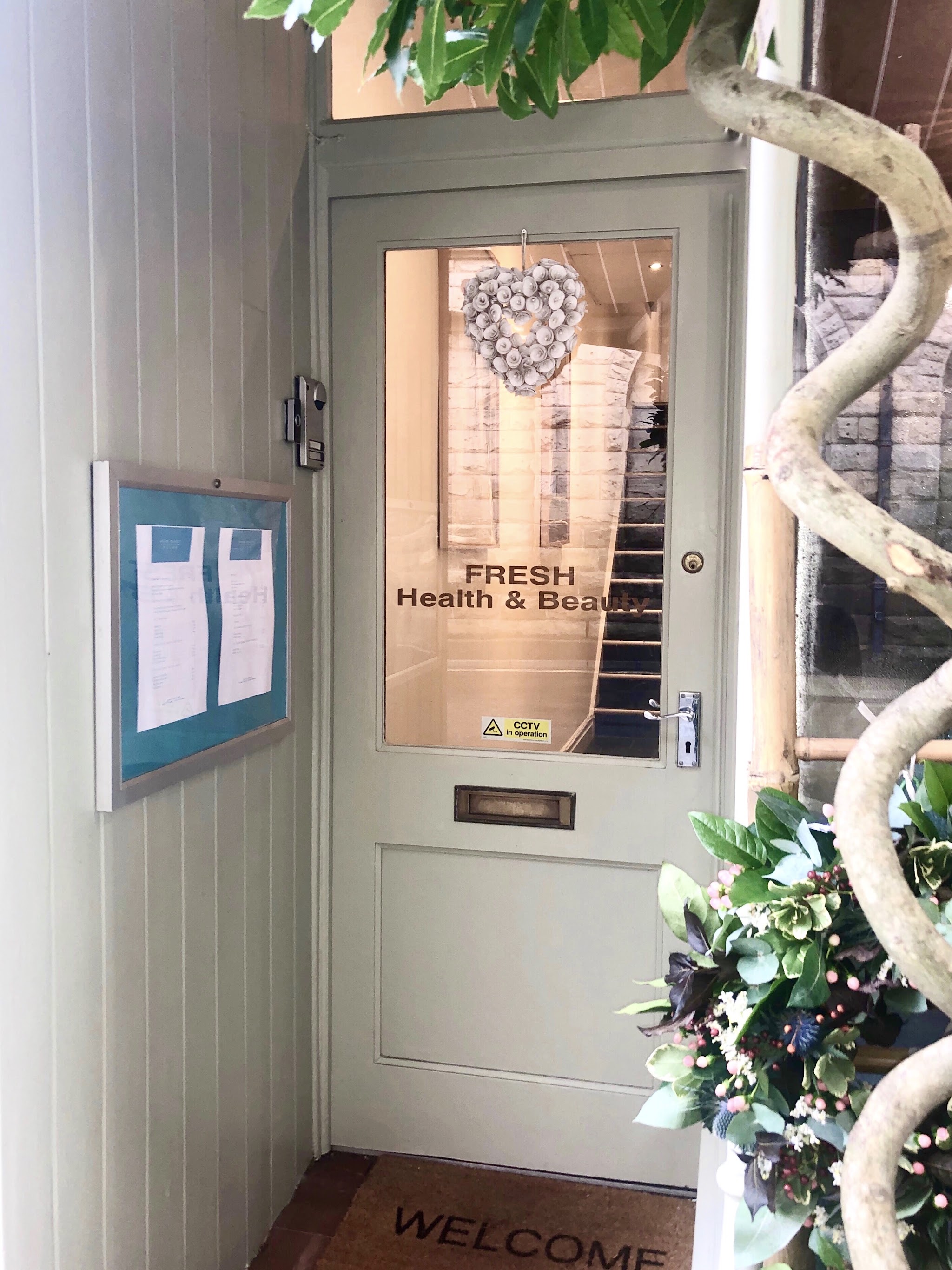 The welcoming entrance door on The Grove, marked Fresh Health and Beauty